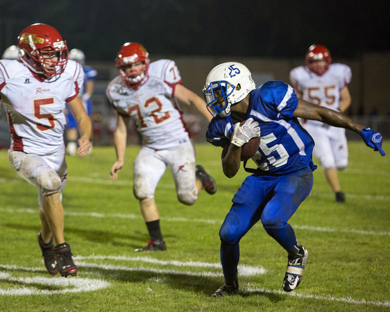 #25 Isaiah Taylor tries to run past #5 Chad Fahey